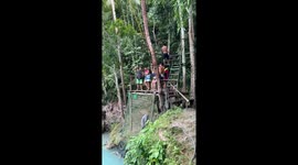 Rope swing into lagoon fails with a splash