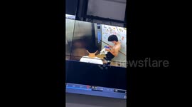 Large snake slithers into elevator sending men fleeing in panic