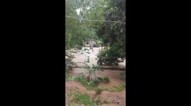 Grandmother trapped in raging flood spawned by heavy rain in the Philippines