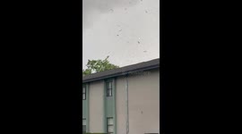 Tornado touches down with debris swirling in Largo, Florida, USA