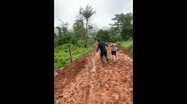 Man slips during muddy downhill run in Puerto Cabezas, Nicaragua