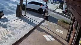 Onlookers rush out to help wheelchair user who topples backwards