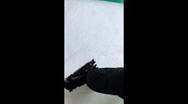 Mechanic uses engine oil to paint portrait on polystyrene board