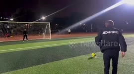 Football players shoe flies off as he tries to take penalty kick