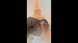Eiffel Tower shrouded by heavy storm in Paris, France