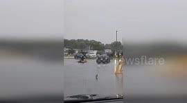 US: Boat Pulls Man From Car As Flooded Street Turns Into River In Holmen