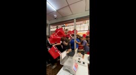 Crazed shoppers rush into opening Japanese thrift store
