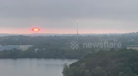 Red Sunrise Pierces Fog Over Cambridge Skyline