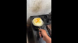 Boy's fried egg hopes shattered as egg lands behind stove after failed flip