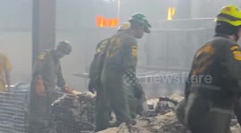 Rescue teams sift through tissue factory fire wreckage in Thailand