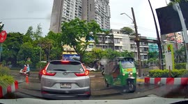 Tree uprooted by storm lands on motorcycle rider
