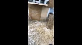 Flooding Through Apartment Building Tears Off Wall