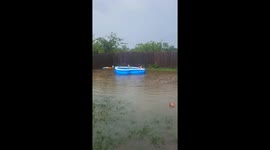 Kids' Floating Pool in Flooded Backyard