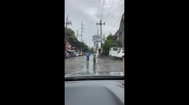 Delivery rider carries six boxes stacked on his head while cycling