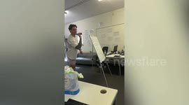 Moment man gets dart lodged in hand during spontaneous game at work