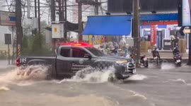 Motorbikes washed away as floods submerge roads in Pattaya