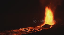 Eruption at Hawaii's Kilauea volcano glows in night sky