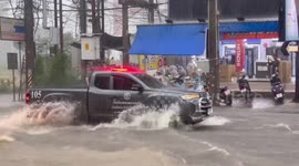 Motorbikes washed away as floods submerge roads in Pattaya