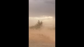 Powerful winds sweep dust across rural land in Hereford, Arizona, USA