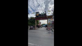 Buddhist temple has a model train above the entrance