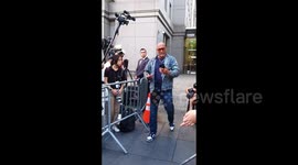 US: Tall unidentified board imposing white man exiting the court waiting for the Sean Combs verdict