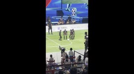 Robots compete in an indoor football match in China