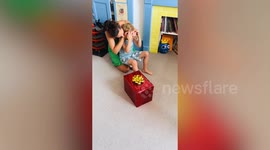 Boy goes wild with joy after being surprised with Iron man helmet