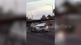 Las Vegas windstorm topples power poles, crushing several cars
