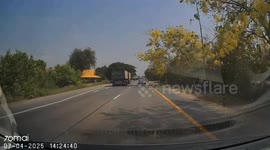 Overtaking truck shunts driver off road into row of trees