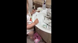 Child caught filling purse with water in Saratov, Russia
