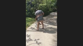 Monkey jumps on woman during photo attempt in Krabi, Thailand