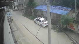 Car collides with motorcycle, crashes into pole in Henan, China