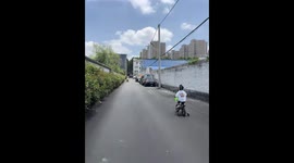 Child crashes bicycle into parked truck in Henan, China