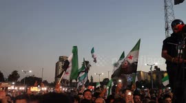 Syria: Participants wave Syrian independence flags as they watch performances