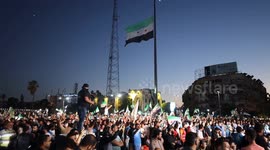 Syria: Participants wave Syrian independence flags as they watch performances in Idlib