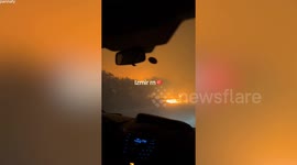 Dramatic video shows motorists driving through wildfire in Turkey