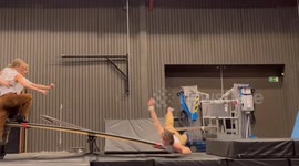 Stomach Stunt On Seesaw By Circus Acrobats