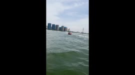 Jet ski sends beachgoers overboard during water ride
