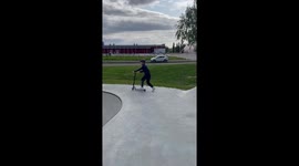 Boy Faceplants While Scootering In Skatepark