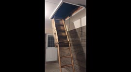 After mysterious rattling of attic door, a man finds an old basket in the attic filled with strange objects