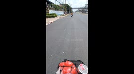 Exhaust pipe from a motorcycle emits soapy bubbles