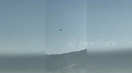 Helicopters dump water on wildfires spreading in Turkey