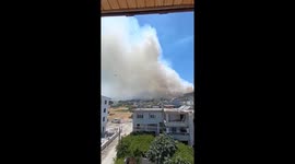 Thick smoke covers burning mountain in Antakya, Turkey