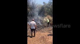 Türkiye: Volunteers attempt to extinguish a wildfire in the Seferihisar district of Izmir