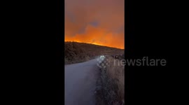 Türkiye: Smoke and flares rise from a forested area following a wildfire in the Cesme district of Izmir
