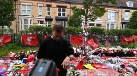 Jordan Henderson laying flowers at Dioga Jotos memorial garden at Anfield stadium