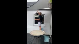 Wife gets soaked after husband cleverly pulls off water prank
