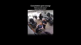 Unexpected mishap: Saloon worker spills tea on client ready for a haircut