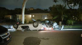 US, Los Angeles: Culver City BMW Rollover Onto Parked Vehicle