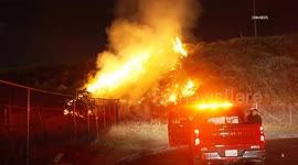 US, Los Angeles: Sylmar Fireworks Spark Grass Fire Near 210 Freeway